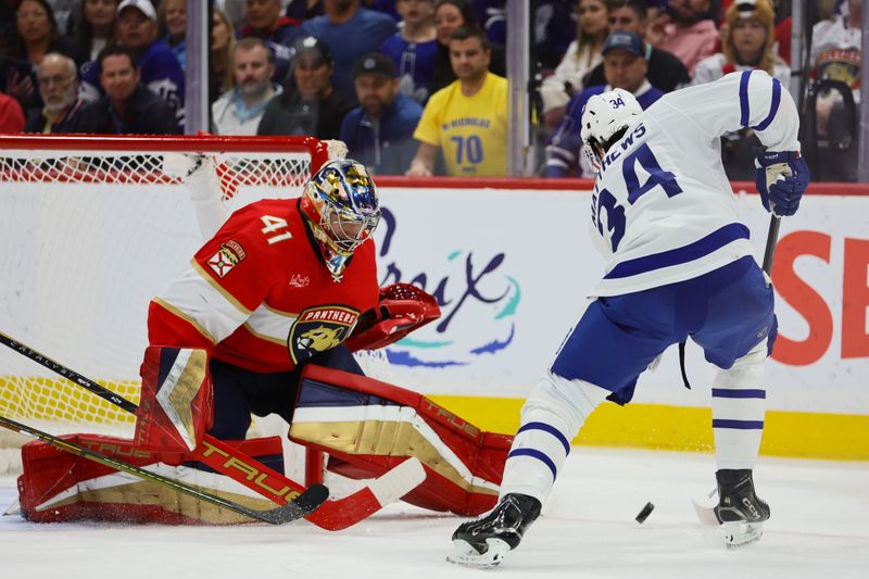 Apr 16, 2024; Sunrise, Florida, USA; Florida Panthers goaltender Anthony Stolarz (41) defends his net against Toronto Maple Leafs center Auston Matthews (34) during the third period at Amerant Bank Arena. Mandatory Credit: Sam Navarro-USA TODAY Sports