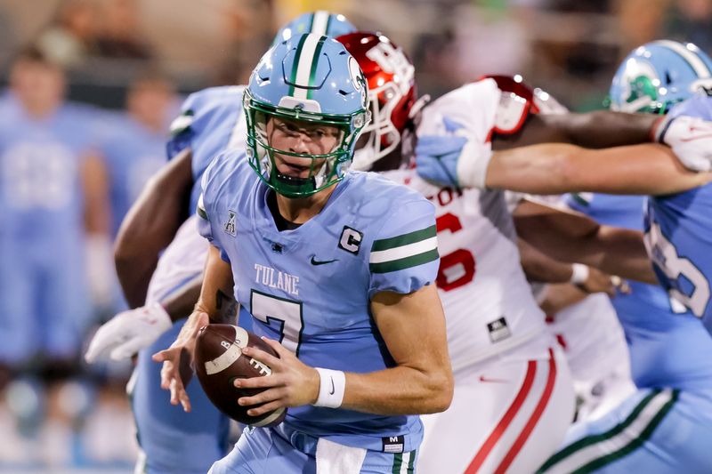 Oct 7, 2021; New Orleans, Louisiana, USA;  Tulane Green Wave quarterback Michael Pratt (7) rolls out to pass against Houston Cougars during the first half at Yulman Stadium. Mandatory Credit: Stephen Lew-USA TODAY Sports