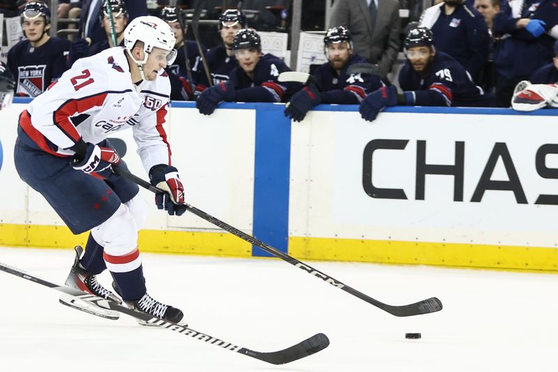 Mar 5, 2025; New York, New York, USA;  Washington Capitals center Aliaksei Protas (21) skates down ice in the first period against the New York Rangers at Madison Square Garden. Mandatory Credit: Wendell Cruz-Imagn Images