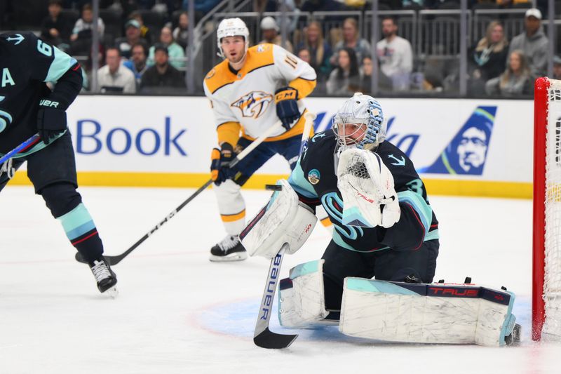 Mar 16, 2024; Seattle, Washington, USA; Seattle Kraken goaltender Philipp Grubauer (31) blocks a goal shot against the Nashville Predators during the first period at Climate Pledge Arena. Mandatory Credit: Steven Bisig-USA TODAY Sports