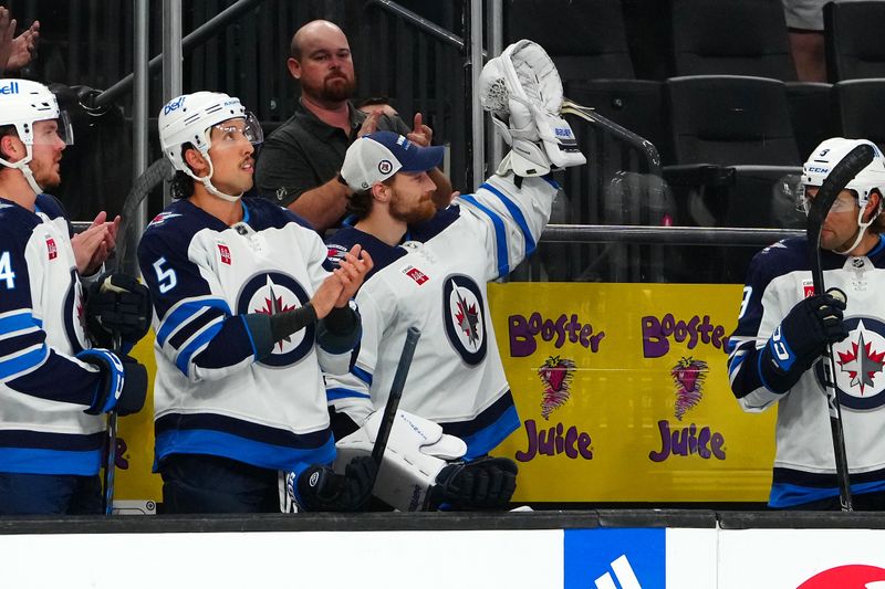 Nov 2, 2023; Las Vegas, Nevada, USA; Winnipeg Jets goaltender Laurent Brossoit (39) acknowledges the crowd as he is recognized for his time with the Vegas Golden Knights during the first period at T-Mobile Arena. Mandatory Credit: Stephen R. Sylvanie-USA TODAY Sports