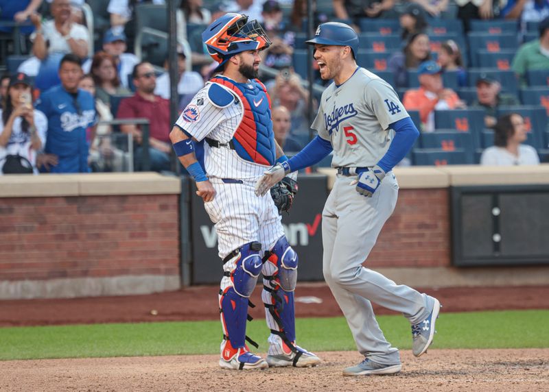 May 28, 2024; New York, NY, USA;  Los Angeles Dodgers first baseman Freddie Freeman (5) reacts after hitting a two run home run during the tenth inning against the New York Mets at Citi Field. Mandatory Credit: Vincent Carchietta-USA TODAY Sports