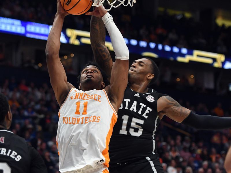 Mar 15, 2024; Nashville, TN, USA; Tennessee Volunteers forward Tobe Awaka (11) has a shot blocked by Mississippi State Bulldogs forward Jimmy Bell Jr. (15) during the first half at Bridgestone Arena. Mandatory Credit: Christopher Hanewinckel-USA TODAY Sports