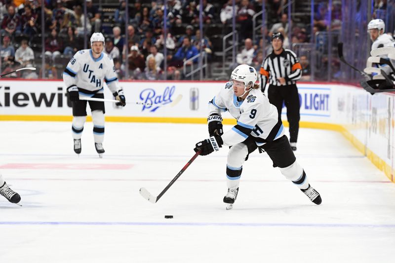 Sep 29, 2024; Denver, Colorado, USA; Utah Hockey Club forward Clayton Keller (9) passes the puck during the first period against the Colorado Avalanche at Ball Arena. Mandatory Credit: Christopher Hanewinckel-Imagn Images