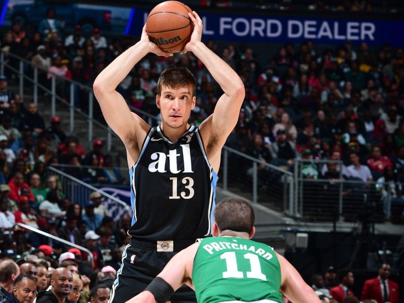 ATLANTA, GA - MARCH 25: Bogdan Bogdanovic #13 of the Atlanta Hawks handles the ball during the game  on March 25, 2024 at State Farm Arena in Atlanta, Georgia.  NOTE TO USER: User expressly acknowledges and agrees that, by downloading and/or using this Photograph, user is consenting to the terms and conditions of the Getty Images License Agreement. Mandatory Copyright Notice: Copyright 2024 NBAE (Photo by Scott Cunningham/NBAE via Getty Images)