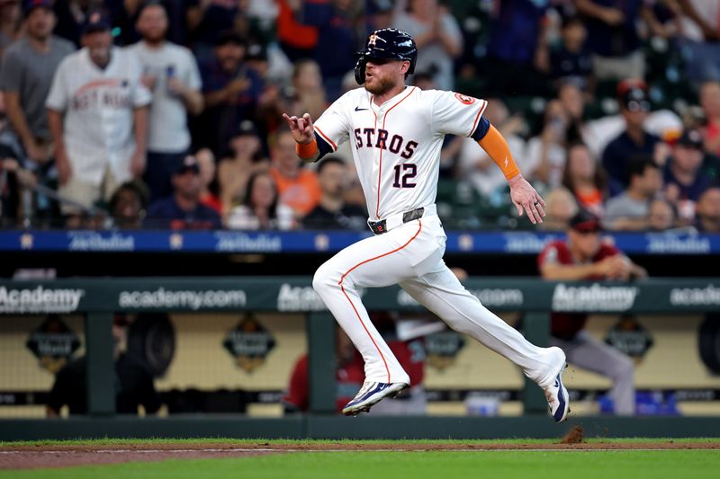 Sep 7, 2024; Houston, Texas, USA; Houston Astros right fielder Ben Gamel (12) run towards home plate to score a run against the Arizona Diamondbacks during the fourth inning at Minute Maid Park. Mandatory Credit: Erik Williams-Imagn Images
