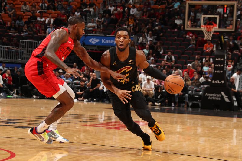 MIAMI, FL - DECEMBER 8: Donovan Mitchell #45 of the Cleveland Cavaliers dribbles the ball during the game against the Miami Heat on December 8, 2024 at Kaseya Center in Miami, Florida. NOTE TO USER: User expressly acknowledges and agrees that, by downloading and or using this Photograph, user is consenting to the terms and conditions of the Getty Images License Agreement. Mandatory Copyright Notice: Copyright 2024 NBAE (Photo by Issac Baldizon/NBAE via Getty Images)