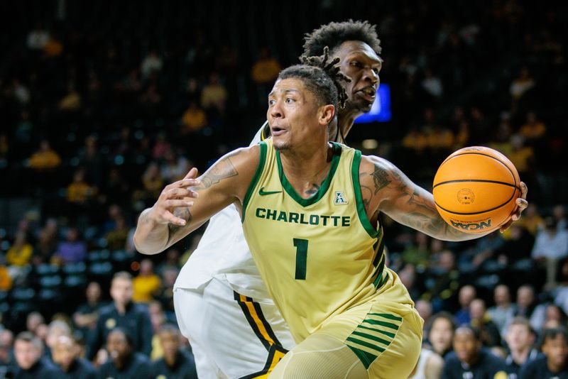 Jan 14, 2025; Wichita, Kansas, USA; Charlotte 49ers forward Giancarlo Rosado (1) drives to the basket during the first half against the Wichita State Shockers at Charles Koch Arena. Mandatory Credit: William Purnell-Imagn Images