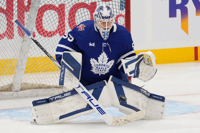 Jan 13, 2024; Toronto, Ontario, CAN; Toronto Maple Leafs goaltender Ilya Samsonov (35) goes to make a save during the warm up before a game against the Colorado Avalanche at Scotiabank Arena. Mandatory Credit: John E. Sokolowski-USA TODAY Sports