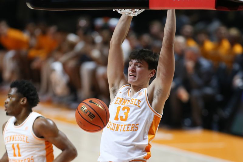 Dec 12, 2023; Knoxville, Tennessee, USA; Tennessee Volunteers forward J.P. Estrella (13) dunks the ball against the Georgia Southern Eagles at Food City Center at Thompson-Boling Arena. Mandatory Credit: Randy Sartin-USA TODAY Sports