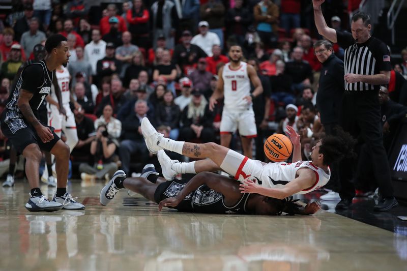 Nov 30, 2022; Lubbock, Texas, USA;  Texas Tech Red Raiders guard Pop Isaacs (2) lands on Georgetown Hoyas forward Bradley Ezewiro (22) in the second half at United Supermarkets Arena. Mandatory Credit: Michael C. Johnson-USA TODAY Sports