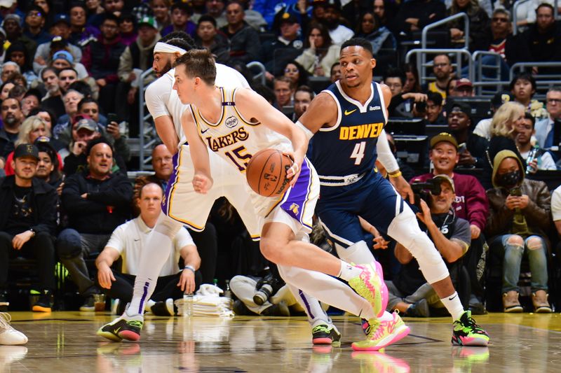 LOS ANGELES, CA - NOVEMBER 23: Austin Reaves #15 of the Los Angeles Lakers dribbles the ball during the game against the Denver Nuggets on November 23, 2024 at Crypto.Com Arena in Los Angeles, California. NOTE TO USER: User expressly acknowledges and agrees that, by downloading and/or using this Photograph, user is consenting to the terms and conditions of the Getty Images License Agreement. Mandatory Copyright Notice: Copyright 2024 NBAE (Photo by Adam Pantozzi/NBAE via Getty Images)