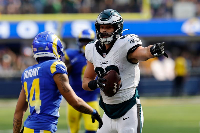 Philadelphia Eagles tight end Dallas Goedert, right, gestures after making a first down as Los Angeles Rams cornerback Cobie Durant looks on during the second half of an NFL football game Sunday, Oct. 8, 2023, in Inglewood, Calif. (AP Photo/Kevork Djansezian)