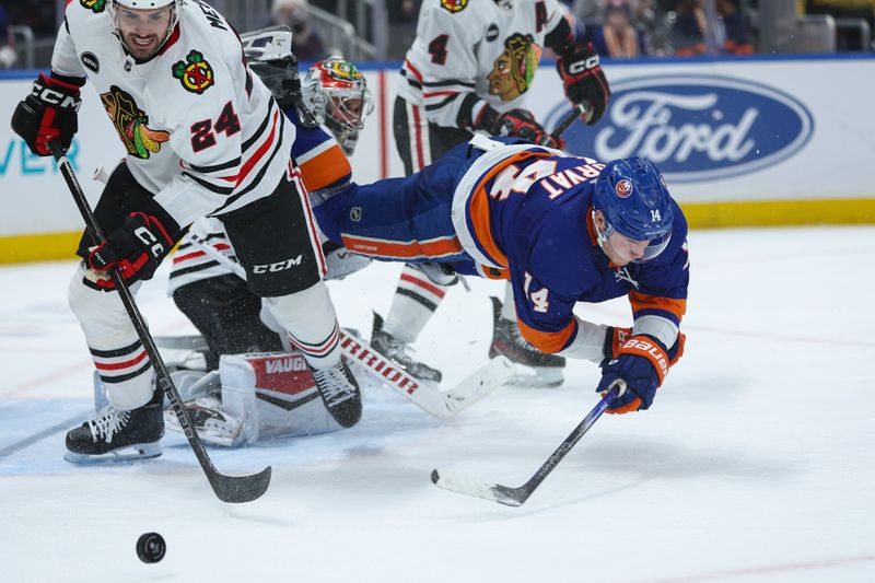 Apr 2, 2024; Elmont, New York, USA; New York Islanders center Bo Horvat (14) after shot in front of the goal against the Chicago Blackhawks during the second period at UBS Arena. Mandatory Credit: Thomas Salus-USA TODAY Sports