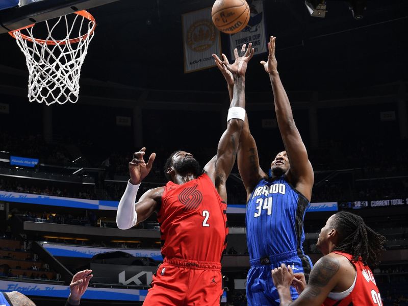 ORLANDO, FL - APRIL 1: Deandre Ayton #2 of the Portland Trail Blazers and Wendell Carter Jr. #34 of the Orlando Magic battle for a rebound on April 1, 2024 at Kia Center in Orlando, Florida. NOTE TO USER: User expressly acknowledges and agrees that, by downloading and or using this photograph, User is consenting to the terms and conditions of the Getty Images License Agreement. Mandatory Copyright Notice: Copyright 2024 NBAE (Photo by Fernando Medina/NBAE via Getty Images)