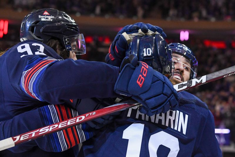 Dec 23, 2023; New York, New York, USA; New York Rangers left wing Artemi Panarin (10) celebrates his goal with New York Rangers center Mika Zibanejad (93) against the Buffalo Sabres during the first period at Madison Square Garden. Mandatory Credit: Dennis Schneidler-USA TODAY Sports