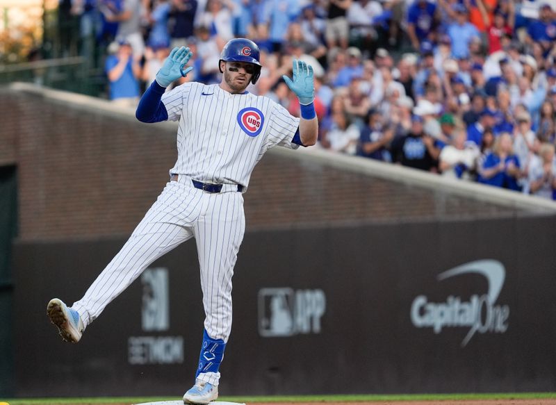 Oct 2, 2025; Chicago, Illinois, USA; Chicago Cubs left fielder Ian Happ (8) celebrates on second base after hitting a double during the fifth inning against the San Diego Padres during game three of the Wildcard round for the 2025 MLB playoffs at Wrigley Field. Mandatory Credit: David Banks-Imagn Images