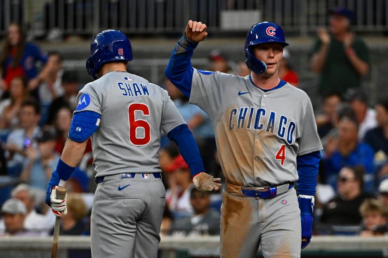 Jun 3, 2025; Washington, District of Columbia, USA; Chicago Cubs center fielder Pete Crow-Armstrong (4) is congratulated by third baseman Matt Shaw (6) after scoring against the Washington Nationals during the fifth inning at Nationals Park. Mandatory Credit: Brad Mills-Imagn Images