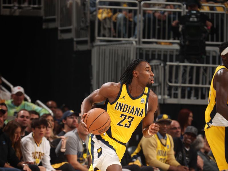 INDIANAPOLIS, IN - APRIL 28: Aaron Nesmith #23 of the Indiana Pacers dribbles the ball during the game against the Milwaukee Bucks during Round 1 Game 4 of the 2024 NBA Playoffs on April 28, 2024 at Gainbridge Fieldhouse in Indianapolis, Indiana. NOTE TO USER: User expressly acknowledges and agrees that, by downloading and or using this Photograph, user is consenting to the terms and conditions of the Getty Images License Agreement. Mandatory Copyright Notice: Copyright 2024 NBAE (Photo by Nathaniel S. Butler/NBAE via Getty Images)
