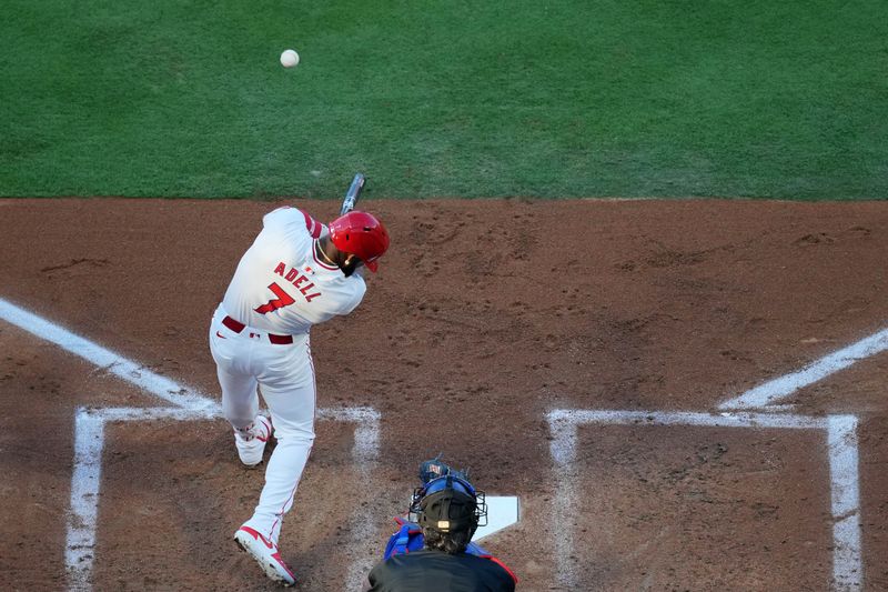 May 6, 2023; Anaheim, California, USA; Los Angeles Angels right fielder Jo Adell (7) hits a RBI single in the first inning against the Texas Rangers at Angel Stadium. Mandatory Credit: Kirby Lee-USA TODAY Sports