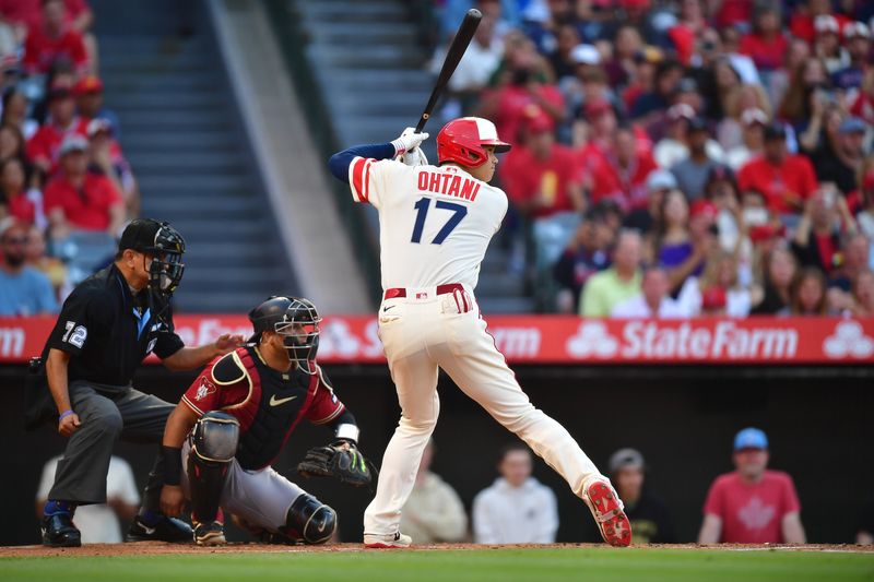 Jul 1, 2023; Anaheim, California, USA; Los Angeles Angels designated hitter Shohei Ohtani (17) hits against the Arizona Diamondbacks during the first inning at Angel Stadium. Mandatory Credit: Gary A. Vasquez-USA TODAY Sports