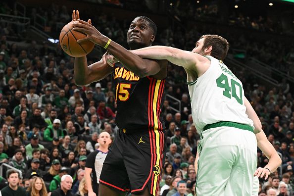 BOSTON, MASSACHUSETTS - NOVEMBER 26: Clint Capela #15 of the Atlanta Hawks is fouled by Luke Kornet #40 of the Boston Celtics during the first quarter at the TD Garden on November 26, 2023 in Boston, Massachusetts. NOTE TO USER: User expressly acknowledges and agrees that, by downloading and or using this photograph, User is consenting to the terms and conditions of the Getty Images License Agreement. (Photo by Brian Fluharty/Getty Images)