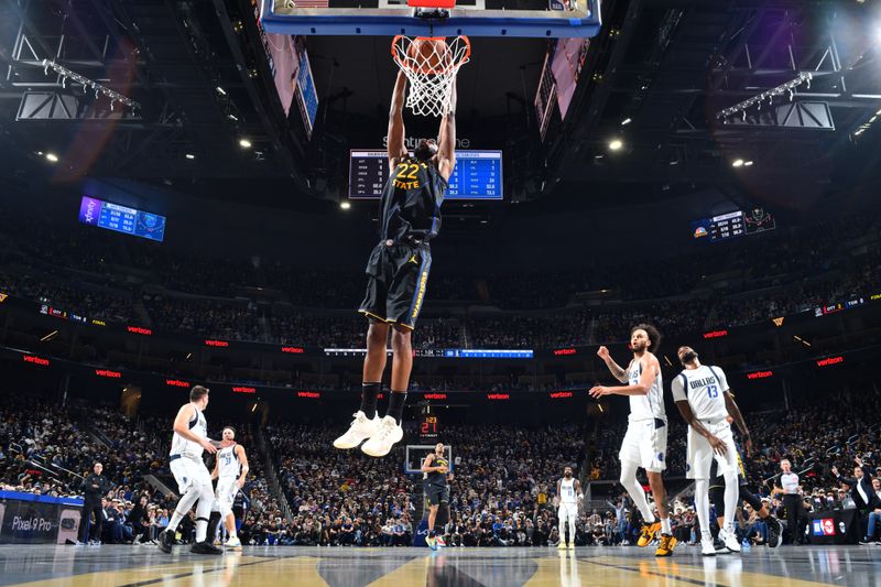 PHOENIX, AZ - NOVEMBER 12: Andrew Wiggins #22 of the Golden State Warriors dunks the ball during the game against the Dallas Mavericks during the Emirates NBA Cup game on November 12, 2024 at Footprint Center in Phoenix, Arizona. NOTE TO USER: User expressly acknowledges and agrees that, by downloading and or using this photograph, user is consenting to the terms and conditions of the Getty Images License Agreement. Mandatory Copyright Notice: Copyright 2024 NBAE (Photo by Barry Gossage/NBAE via Getty Images)