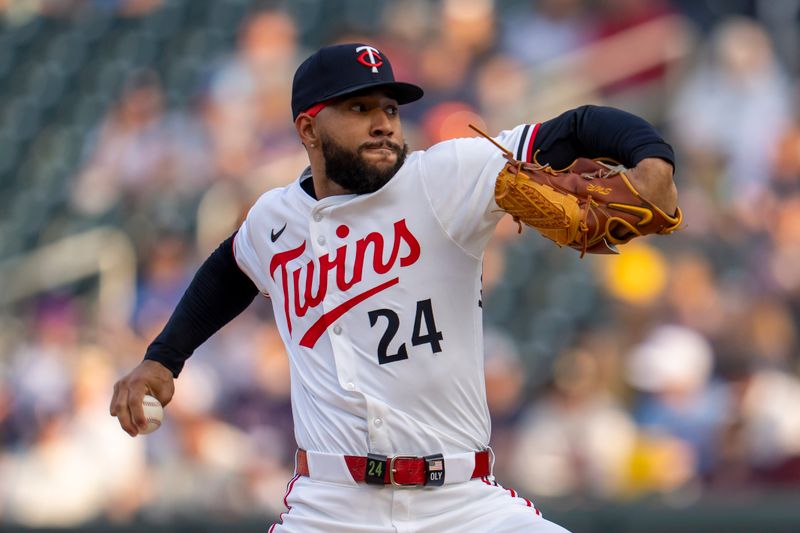 Jun 10, 2025; Minneapolis, Minnesota, USA; Minnesota Twins starting pitcher Simeon Woods Richardson (24) delivers a pitch against the Texas Rangers in the first inning at Target Field. Mandatory Credit: Jesse Johnson-Imagn Images