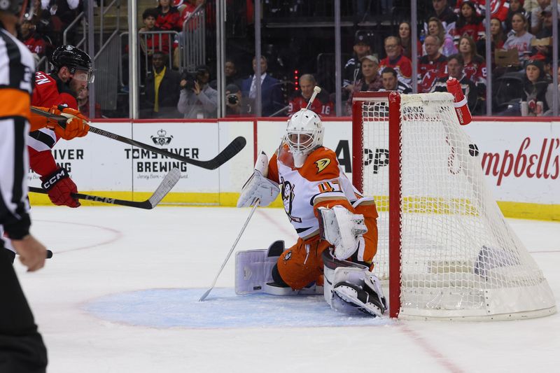 Oct 27, 2024; Newark, New Jersey, USA; New Jersey Devils right wing Stefan Noesen (11) scores a goal on Anaheim Ducks goaltender James Reimer (47) during the second period at Prudential Center. Mandatory Credit: Ed Mulholland-Imagn Images