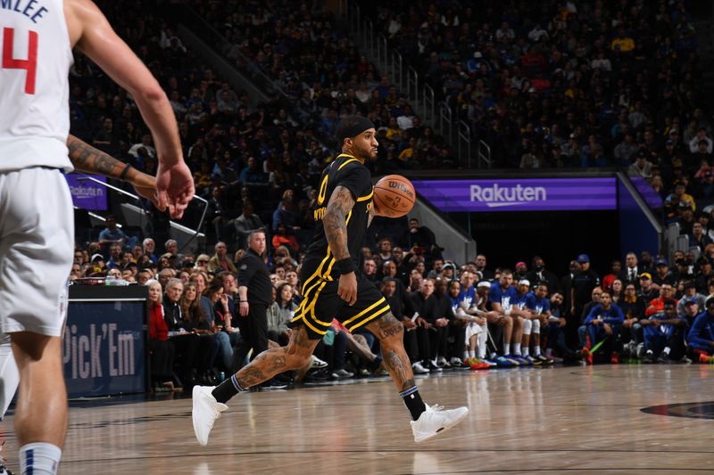 SAN FRANCISCO, CA - FEBRUARY 14: Gary Payton II #0 of the Golden State Warriors dribbles the ball during the game against the LA Clippers on FEBRUARY 14, 2024 at Chase Center in San Francisco, California. NOTE TO USER: User expressly acknowledges and agrees that, by downloading and or using this photograph, user is consenting to the terms and conditions of Getty Images License Agreement. Mandatory Copyright Notice: Copyright 2024 NBAE (Photo by Noah Graham/NBAE via Getty Images)