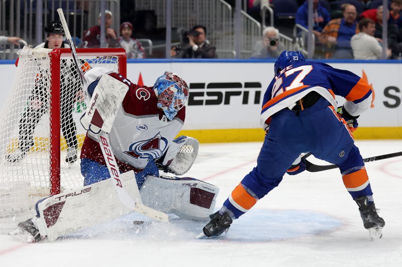 Jan 28, 2025; Elmont, New York, USA; New York Islanders left wing Anders Lee (27) scores a goal against Colorado Avalanche goaltender Mackenzie Blackwood (39) during the second period at UBS Arena. Mandatory Credit: Brad Penner-Imagn Images