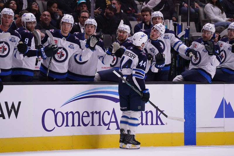 Nov 7, 2025; San Jose, California, USA; Winnipeg Jets defenseman Josh Morrissey (44) shakes hands with his teammates on the bench after scoring a goal against the San Jose Sharks during the first period at SAP Center at San Jose. Mandatory Credit: David Gonzales-Imagn Images