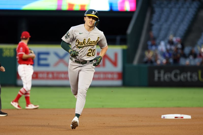 Sep 30, 2023; Anaheim, California, USA; Oakland Athletics second baseman Zack Gelof (20) runs around the bases after hitting a home run during the first inning against the Los Angeles Angels at Angel Stadium. Mandatory Credit: Kiyoshi Mio-USA TODAY Sports