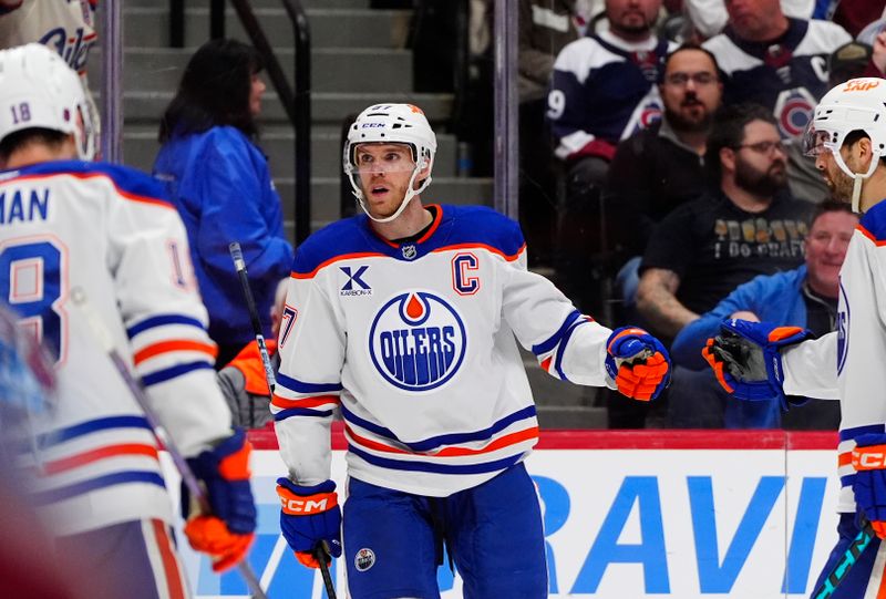 Mar 10, 2026; Denver, Colorado, USA; Edmonton Oilers center Connor McDavid (97) celebrates his go ahead goal in the third period against the Colorado Avalanche at Ball Arena. Mandatory Credit: Ron Chenoy-Imagn Images