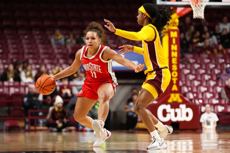 Feb 8, 2024; Minneapolis, Minnesota, USA; Ohio State Buckeyes guard Kaia Henderson (11) dribbles as Minnesota Golden Gophers guard Janay Sanders (30) defends during the second half at Williams Arena. Mandatory Credit: Matt Krohn-USA TODAY Sports