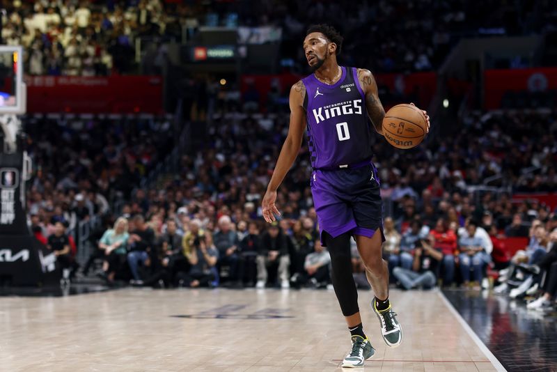 LOS ANGELES, CALIFORNIA - FEBRUARY 25: Malik Monk #0 of the Sacramento Kings brings the ball up court during the fourth quarter against the Los Angeles Clippers at Crypto.com Arena on February 25, 2024 in Los Angeles, California. The Sacramento Kings defeated the Los Angeles Clippers 123-107. NOTE TO USER: User expressly acknowledges and agrees that, by downloading and or using this photograph, User is consenting to the terms and conditions of the Getty Images License Agreement. (Photo by Katelyn Mulcahy/Getty Images)