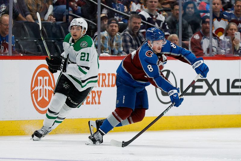 May 13, 2024; Denver, Colorado, USA; Colorado Avalanche defenseman Cale Makar (8) passes the puck ahead of Dallas Stars left wing Jason Robertson (21) in the second period in game four of the second round of the 2024 Stanley Cup Playoffs at Ball Arena. Mandatory Credit: Isaiah J. Downing-USA TODAY Sports