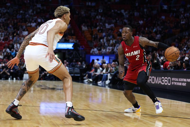 MIAMI, FLORIDA - FEBRUARY 07: Terry Rozier #2 of the Miami Heat dribbles the ball against Jeremy Sochan #10 of the San Antonio Spurs during the first quarter at Kaseya Center on February 07, 2024 in Miami, Florida. NOTE TO USER: User expressly acknowledges and agrees that, by downloading and or using this photograph, User is consenting to the terms and conditions of the Getty Images License Agreement. (Photo by Megan Briggs/Getty Images)