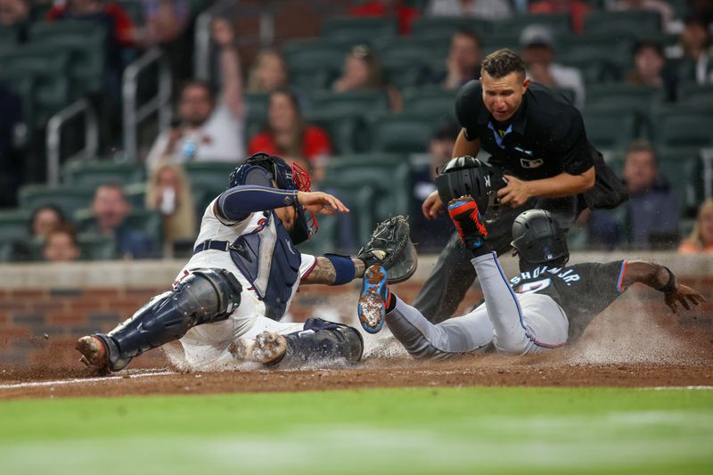 Apr 24, 2024; Atlanta, Georgia, USA; Atlanta Braves catcher Chadwick Tromp (45) tags out Miami Marlins center fielder Jazz Chisholm Jr. (2) in the ninth inning at Truist Park. Mandatory Credit: Brett Davis-USA TODAY Sports