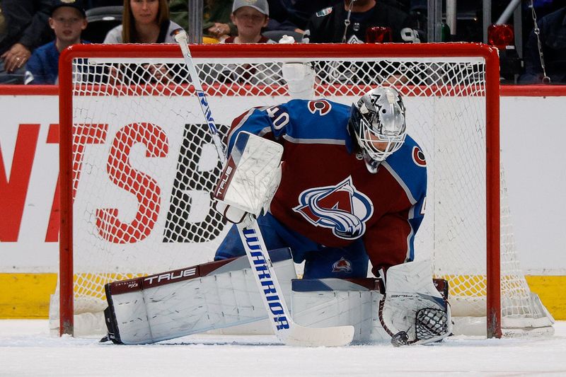 Apr 11, 2023; Denver, Colorado, USA; Colorado Avalanche goaltender Alexandar Georgiev (40) controls the puck in the second period against the Edmonton Oilers at Ball Arena. Mandatory Credit: Isaiah J. Downing-USA TODAY Sports