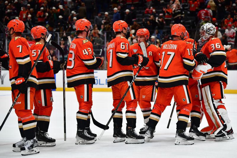 Nov 15, 2024; Anaheim, California, USA; Anaheim Ducks celebrate the victory against the Detroit Red Wings at Honda Center. Mandatory Credit: Gary A. Vasquez-Imagn Images