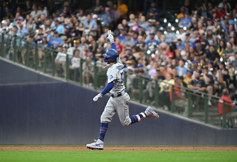 Aug 12, 2024; Milwaukee, Wisconsin, USA; Los Angeles Dodgers right field Mookie Betts (50) rounds the bases after hitting a home run against the Milwaukee Brewers at American Family Field. Mandatory Credit: Michael McLoone-USA TODAY Sports