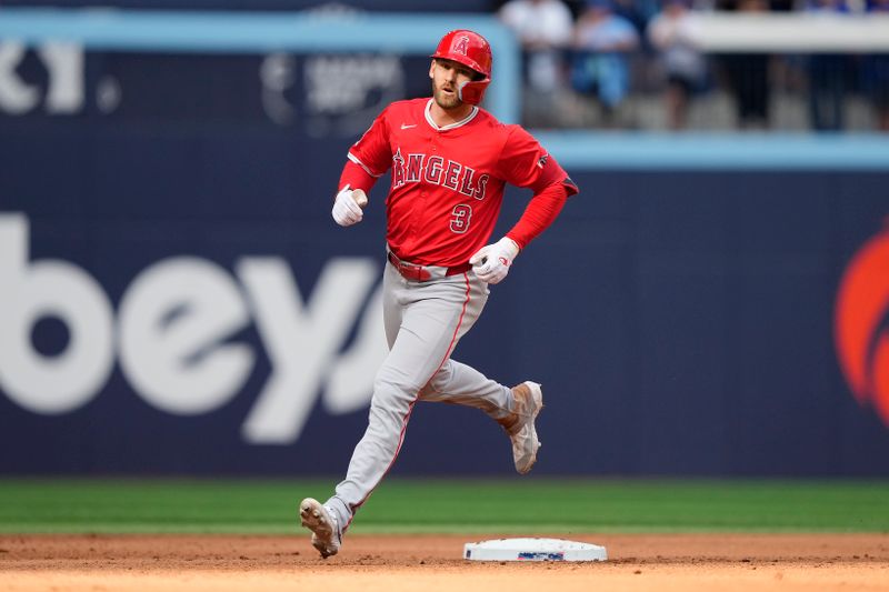 Aug 24, 2024; Toronto, Ontario, CAN; Los Angeles Angels left fielder Taylor Ward (3) runs the bases after hitting a solo home run to break a no hitter by Toronto Blue Jays starting pitcher Bowden Francis (not pictured) during the  ninth inning at Rogers Centre. Mandatory Credit: John E. Sokolowski-USA TODAY Sports