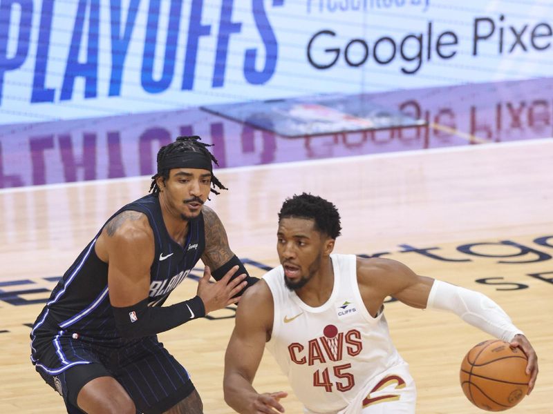 CLEVELAND, OH - APRIL 22: Donovan Mitchell #45 of the Cleveland Cavaliers dribbles the ball during the game against the Orlando Magic during Round 1 Game 2 of the 2024 NBA Playoffs on April 22, 2024 at Rocket Mortgage FieldHouse in Cleveland, Ohio. NOTE TO USER: User expressly acknowledges and agrees that, by downloading and/or using this Photograph, user is consenting to the terms and conditions of the Getty Images License Agreement. Mandatory Copyright Notice: Copyright 2024 NBAE (Photo by Lauren Leigh Bacho/NBAE via Getty Images)