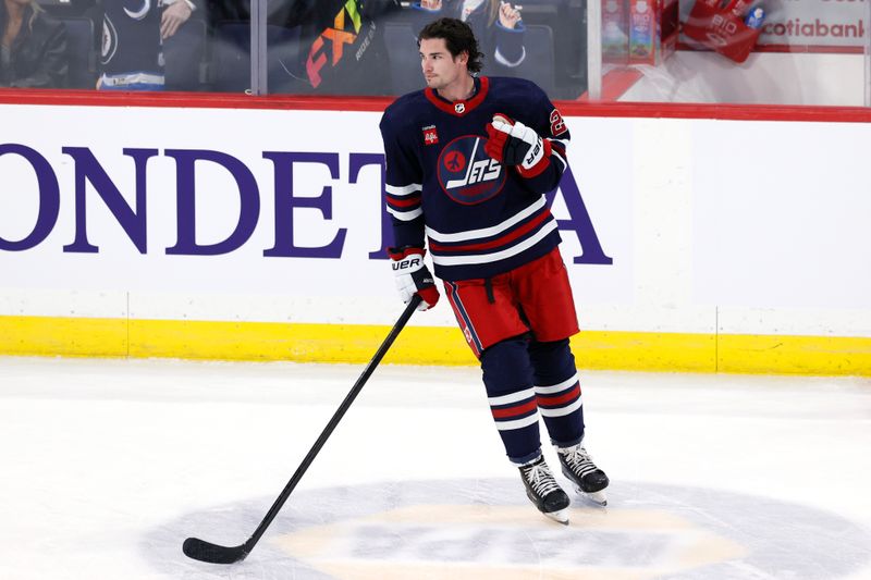 Feb 14, 2024; Winnipeg, Manitoba, CAN; Winnipeg Jets Sean Monahan (23) warms up before a game against the San Jose Sharks at Canada Life Centre. Mandatory Credit: James Carey Lauder-USA TODAY Sports