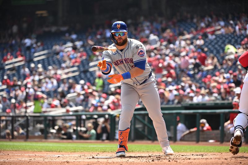 Jul 4, 2024; Washington, District of Columbia, USA; New York Mets right fielder DJ Stewart (29) tosses hit bat after drawing a walk against the Washington Nationals during the second inning at Nationals Park. Mandatory Credit: Rafael Suanes-USA TODAY Sports