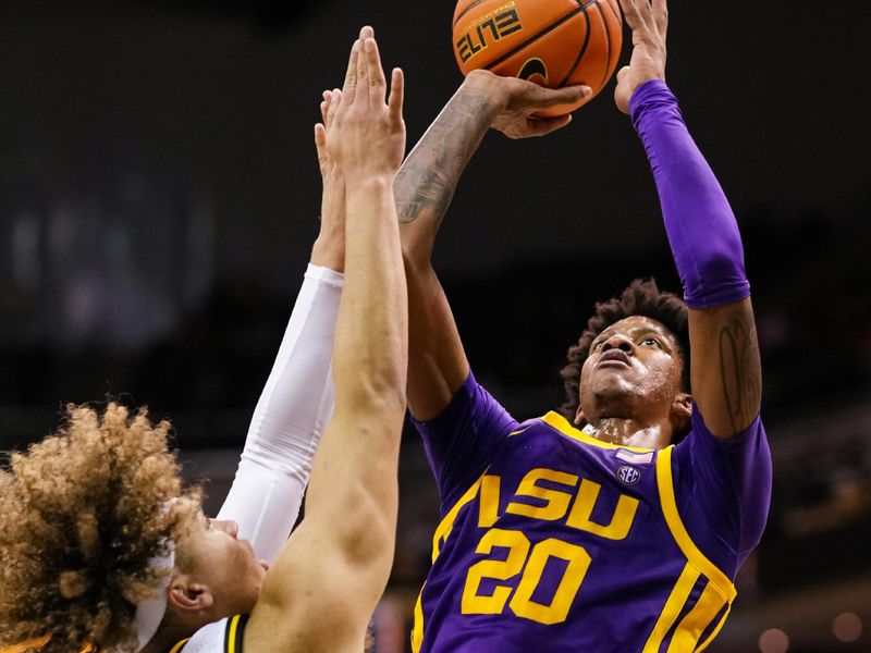 Feb 1, 2023; Columbia, Missouri, USA; LSU Tigers forward Derek Fountain (20) shoots against Missouri Tigers forward Noah Carter (35) during the second half at Mizzou Arena. Mandatory Credit: Jay Biggerstaff-USA TODAY Sports