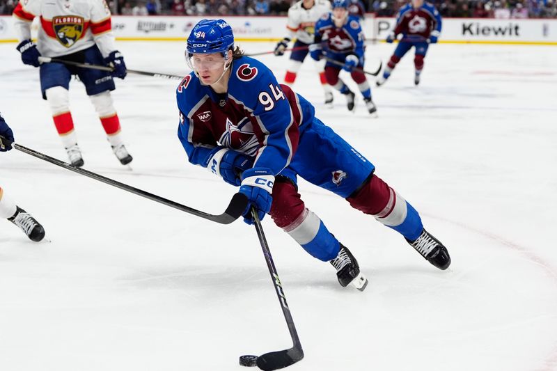 Jan 6, 2025; Denver, Colorado, USA; Colorado Avalanche left wing Joel Kiviranta (94) controls the puck in the second period against the Florida Panthers at Ball Arena. Mandatory Credit: Ron Chenoy-Imagn Images