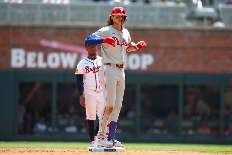 Jul 7, 2024; Atlanta, Georgia, USA; Philadelphia Phillies third baseman Alec Bohm (28) reacts after a double against the Atlanta Braves in the sixth inning at Truist Park. Mandatory Credit: Brett Davis-USA TODAY Sports