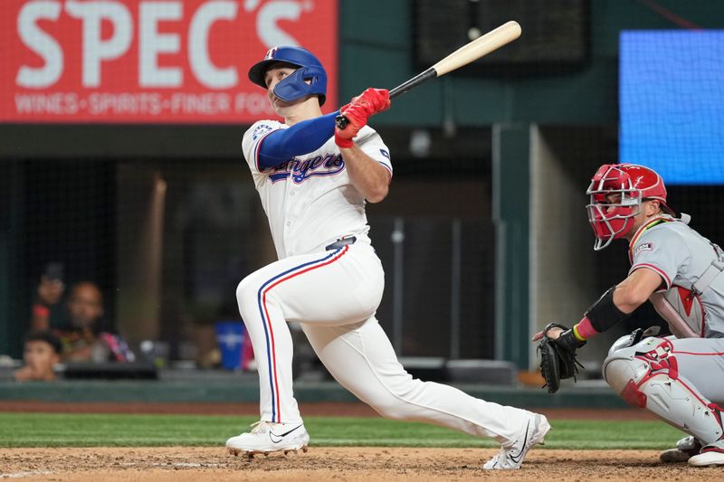 Sep 7, 2024; Arlington, Texas, USA; Texas Rangers center fielder Wyatt Langford (36) follows through on a RBI double against the Los Angeles Angels during the eighth inning at Globe Life Field. Mandatory Credit: Jim Cowsert-Imagn Images